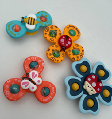 4 Pack Fidget Spinners for Babies on Amazon Image shows 4 fidget spinner toys